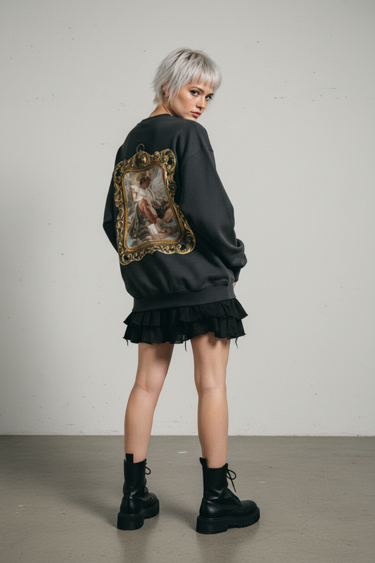 Black long-sleeve shirt with a decorative gold frame design on the back against a white background