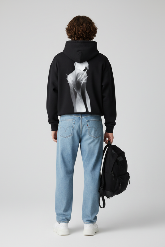 Black hoodie with a graphic design on the back against a white background