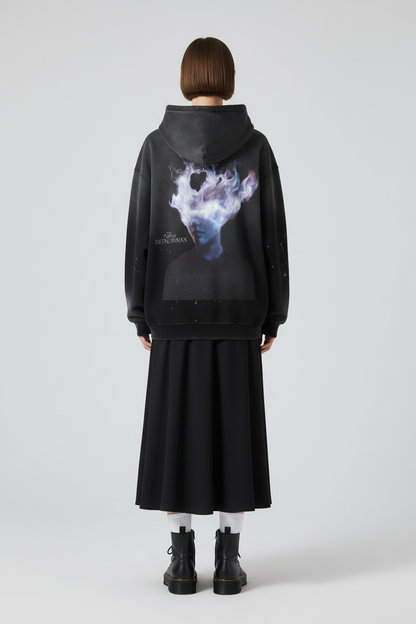 Black hoodie with a graphic design on the back featuring a person with a cloud-like head and text 'Being Human'.