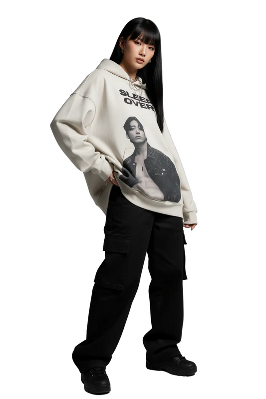 Beige hoodie with graphic of a person and 'Sleep Over' text on a white background