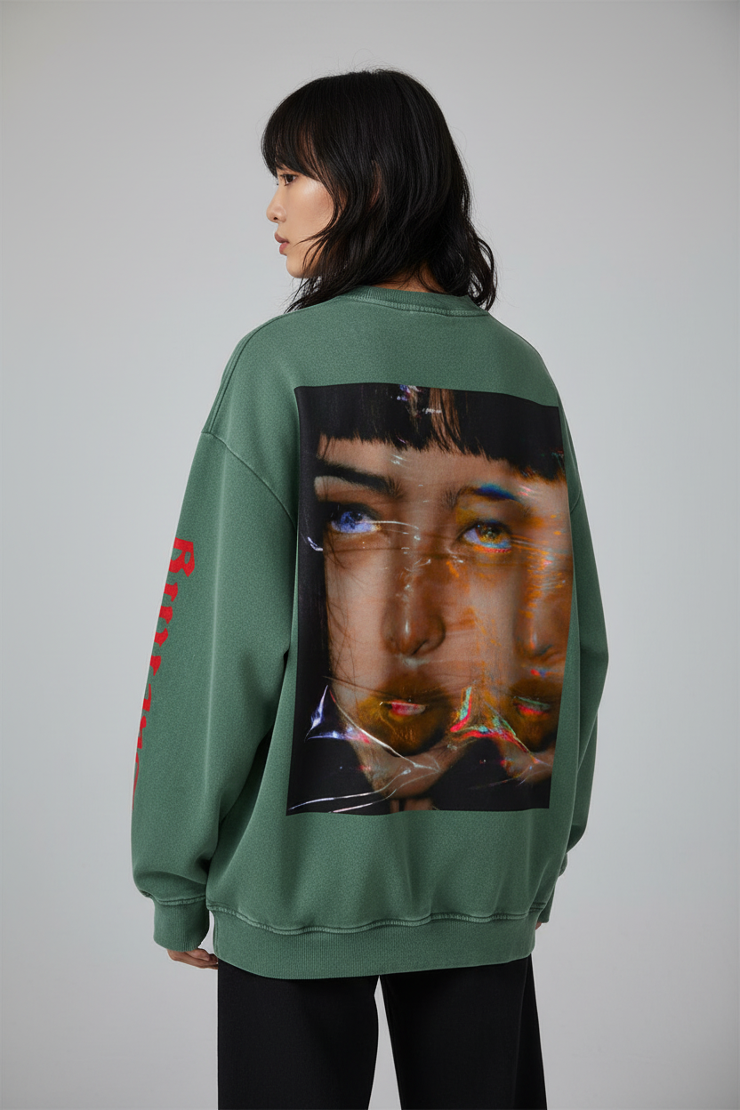 Green sweatshirt with a graphic of a face on the back, on a white background