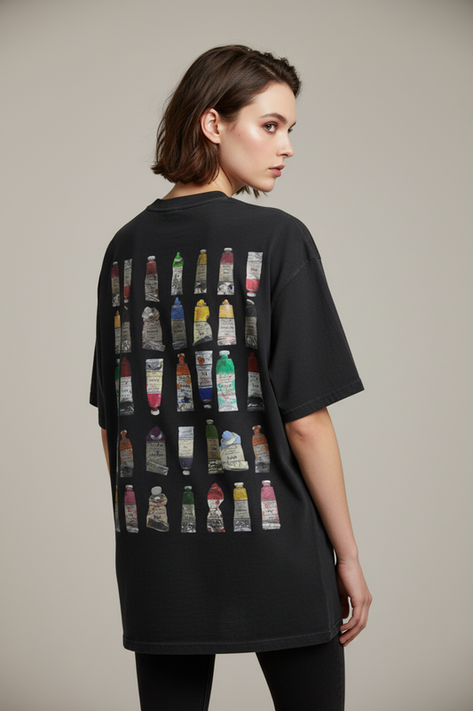 Black t-shirt with colorful bottle graphic on a white background