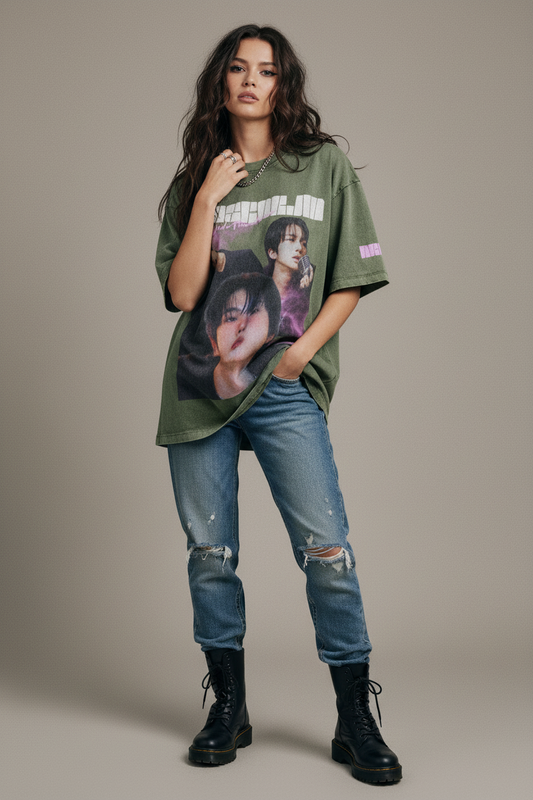 Green t-shirt with graphic design of a person and text on a white background