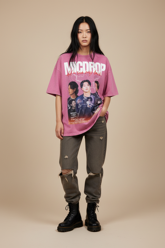 Pink t-shirt with graphic design and text on a white background