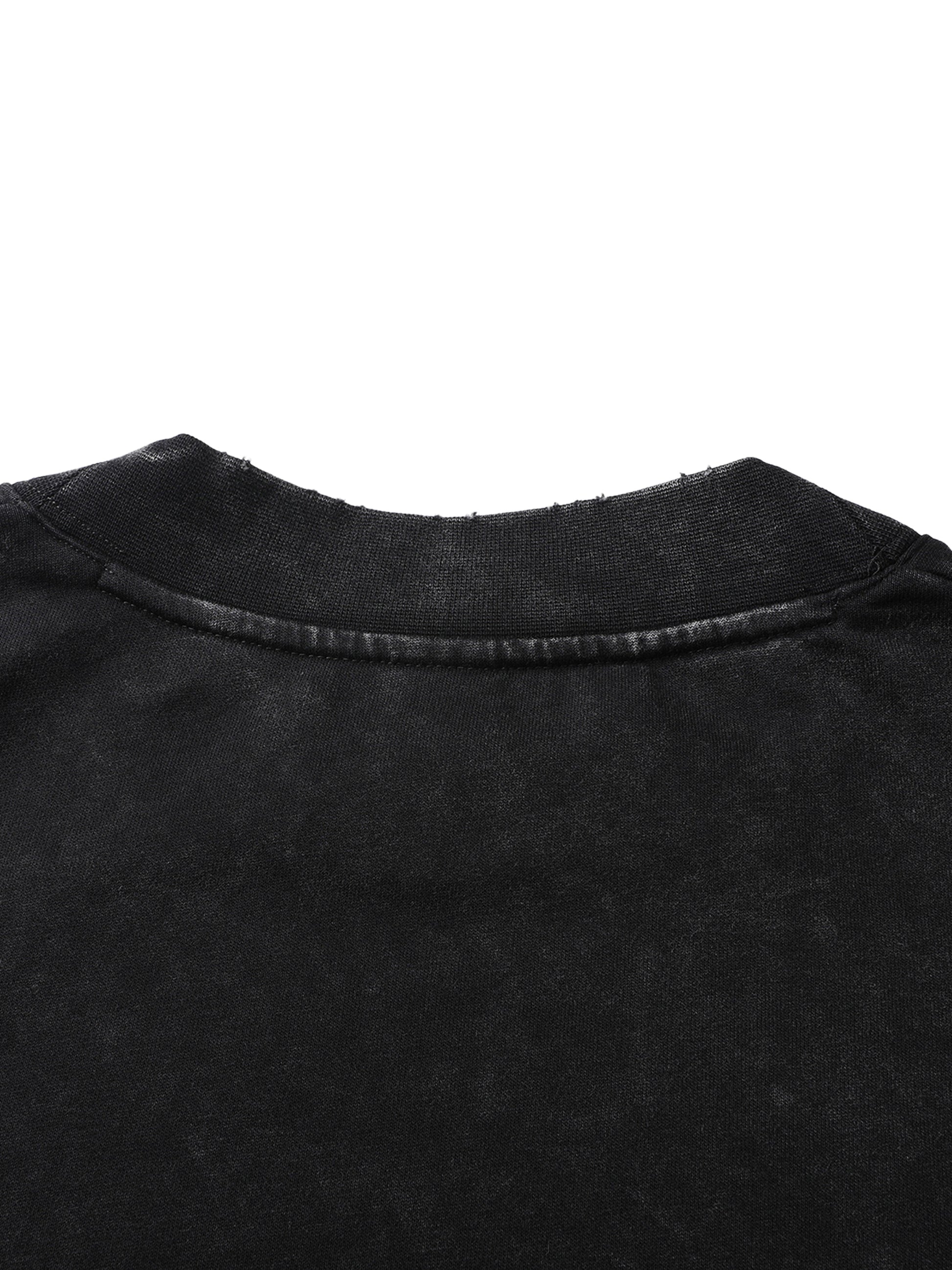 Close-up of a black garment with a collar on a white background