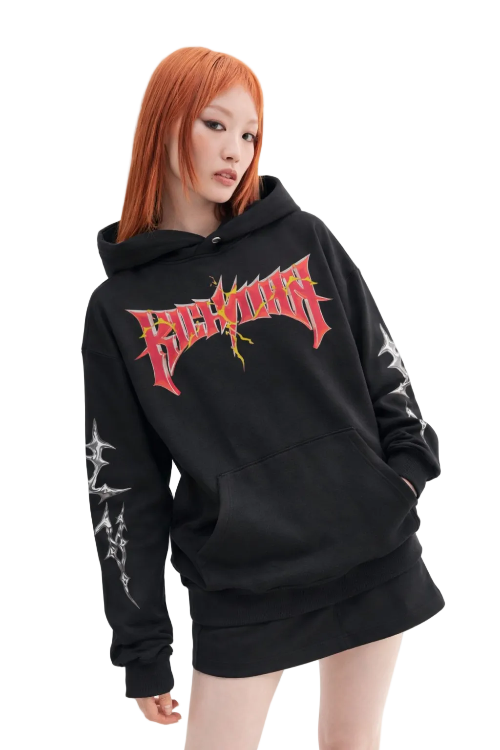 Person wearing a black hoodie with red and white graphic design on a white background