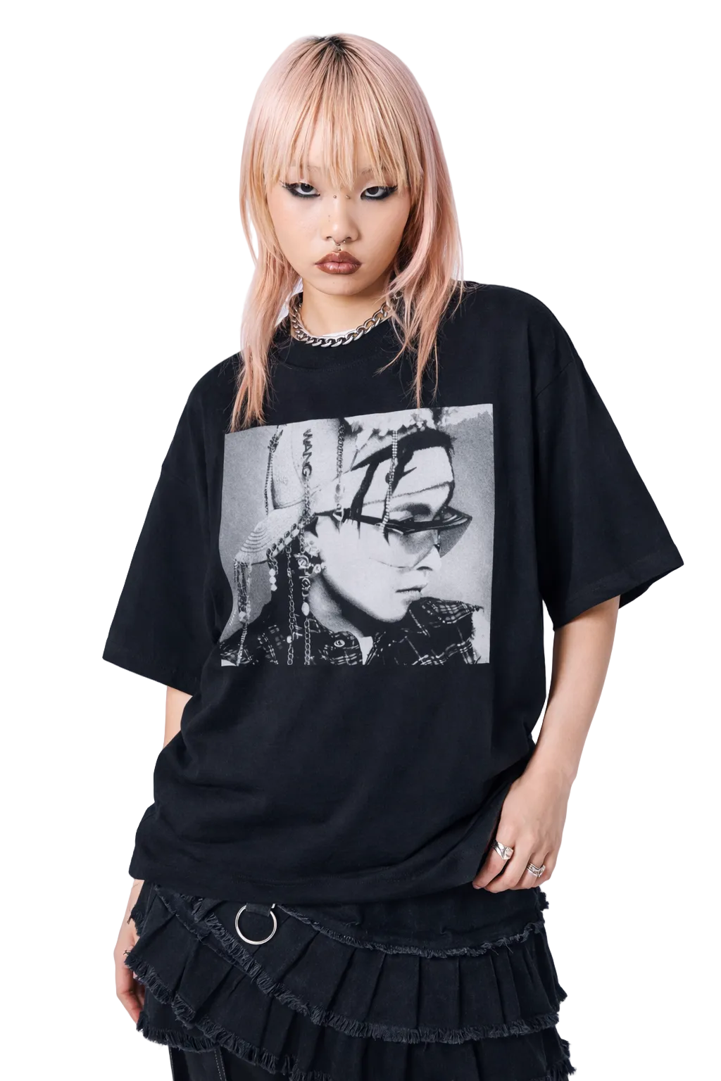 Person wearing a black t-shirt with a graphic design on a white background