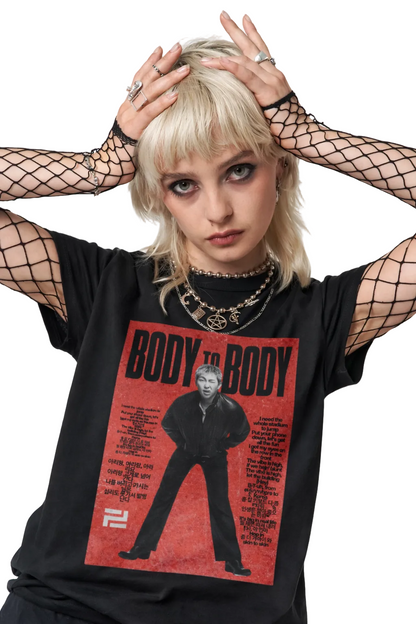 Person wearing a black t-shirt with a graphic design and text.