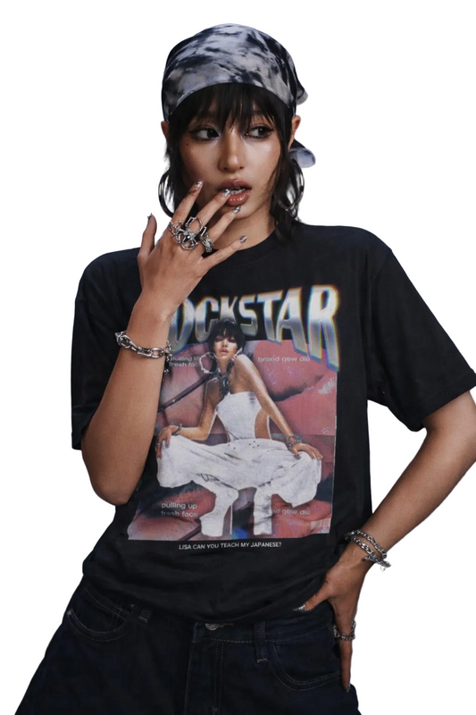 Person wearing a black t-shirt with a graphic design on a blue background