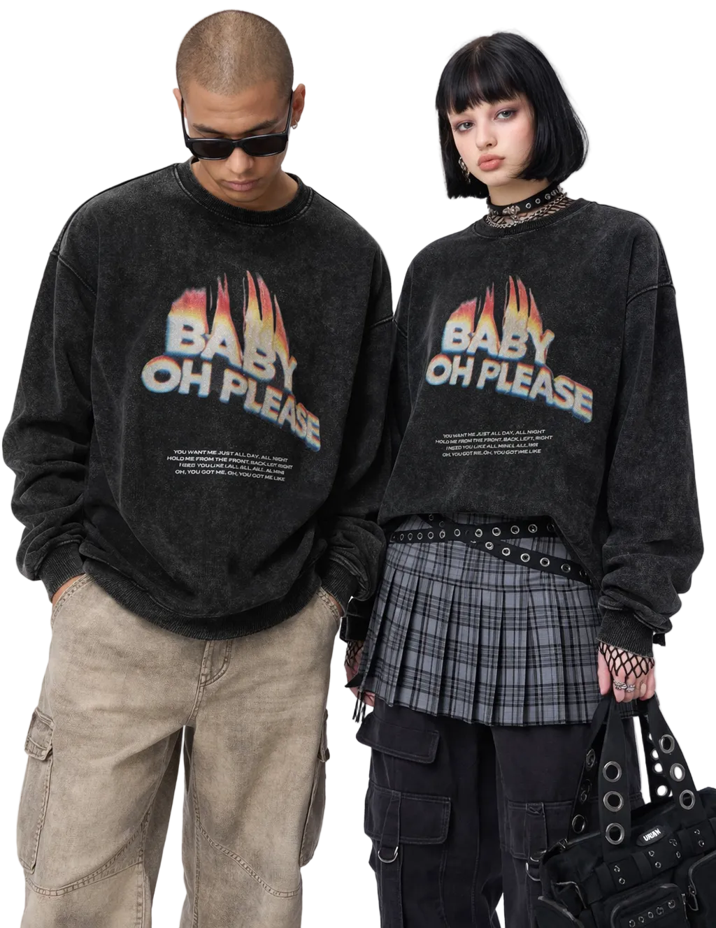 Two people wearing black sweatshirts with colorful text, standing side by side against a white background.