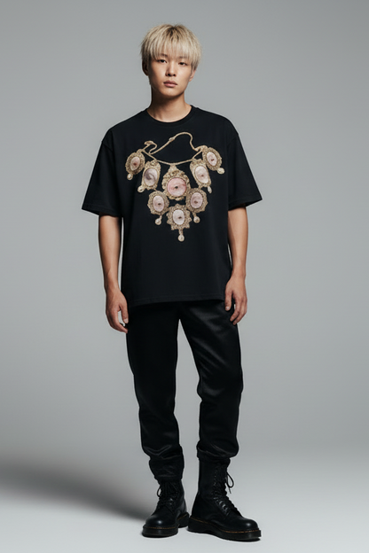 Black t-shirt with an ornate necklace design on a white background