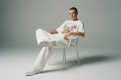 White t-shirt with a decorative necklace design on a white background