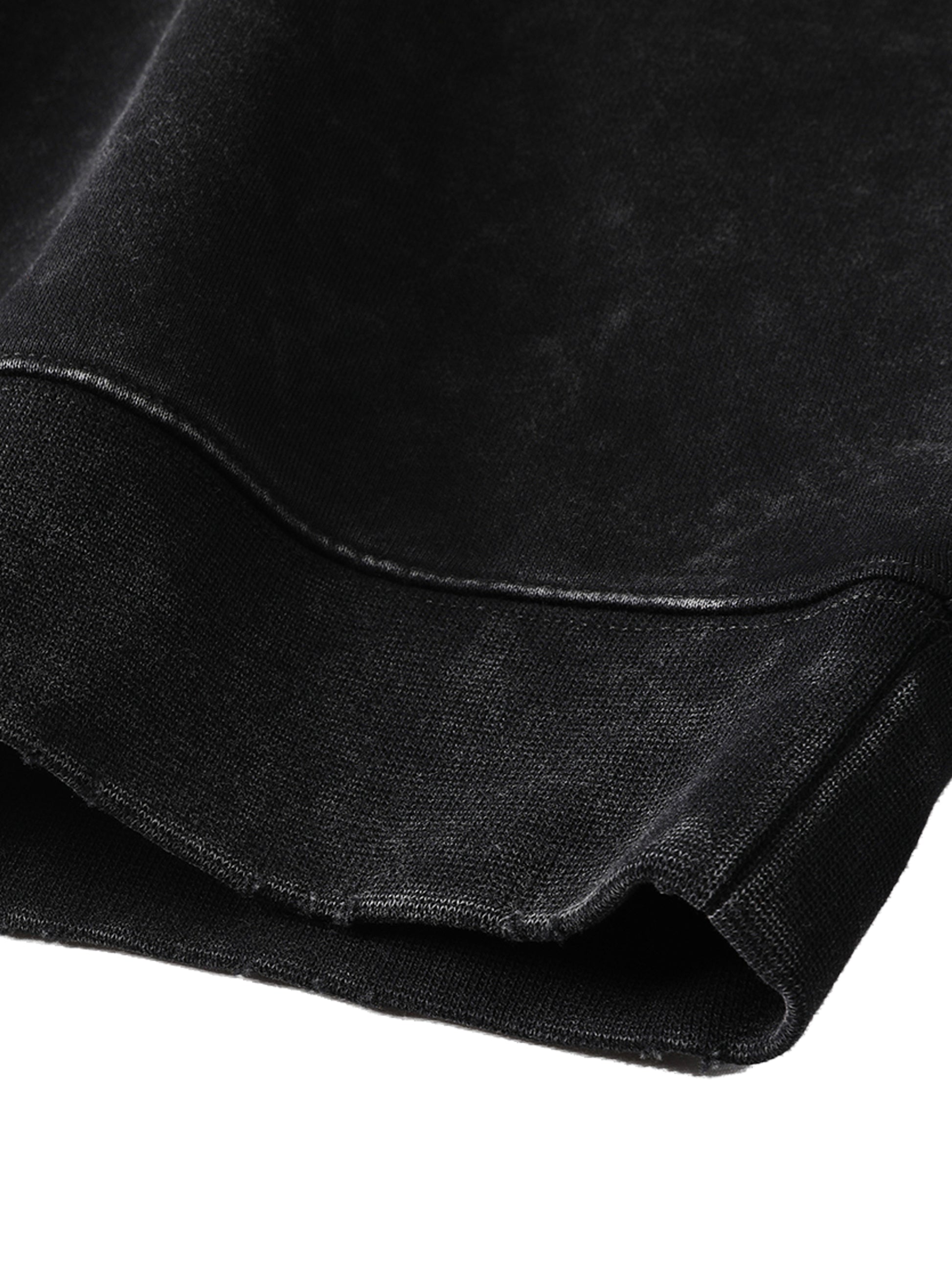 Close-up of black fabric with a subtle texture on a white background