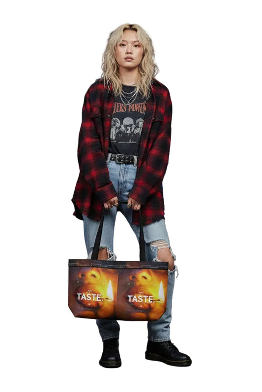 Tote bag with a graphic of a mouth and the text 'Don't Taste.' on a white background