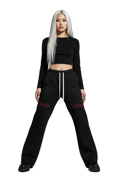 Black flared pants on a white background